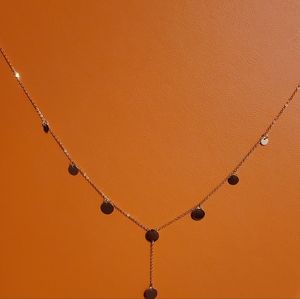Brand new 14kt yellow gold disc lariat necklace